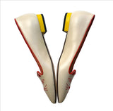 Charlotte Olympia Mid Century Kitty Cream flats with yellow heel and red accent