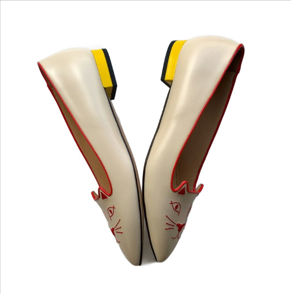 Charlotte Olympia Mid Century Kitty Cream flats with yellow heel and red accent